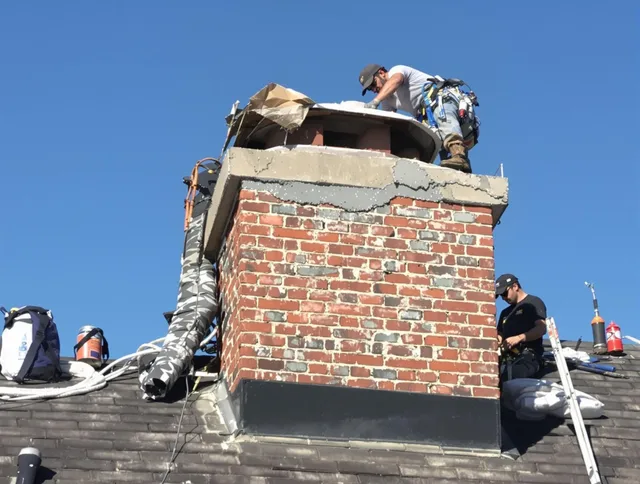Ontario Chimney Sweep installing a custom chimney crown in Ontario, CA